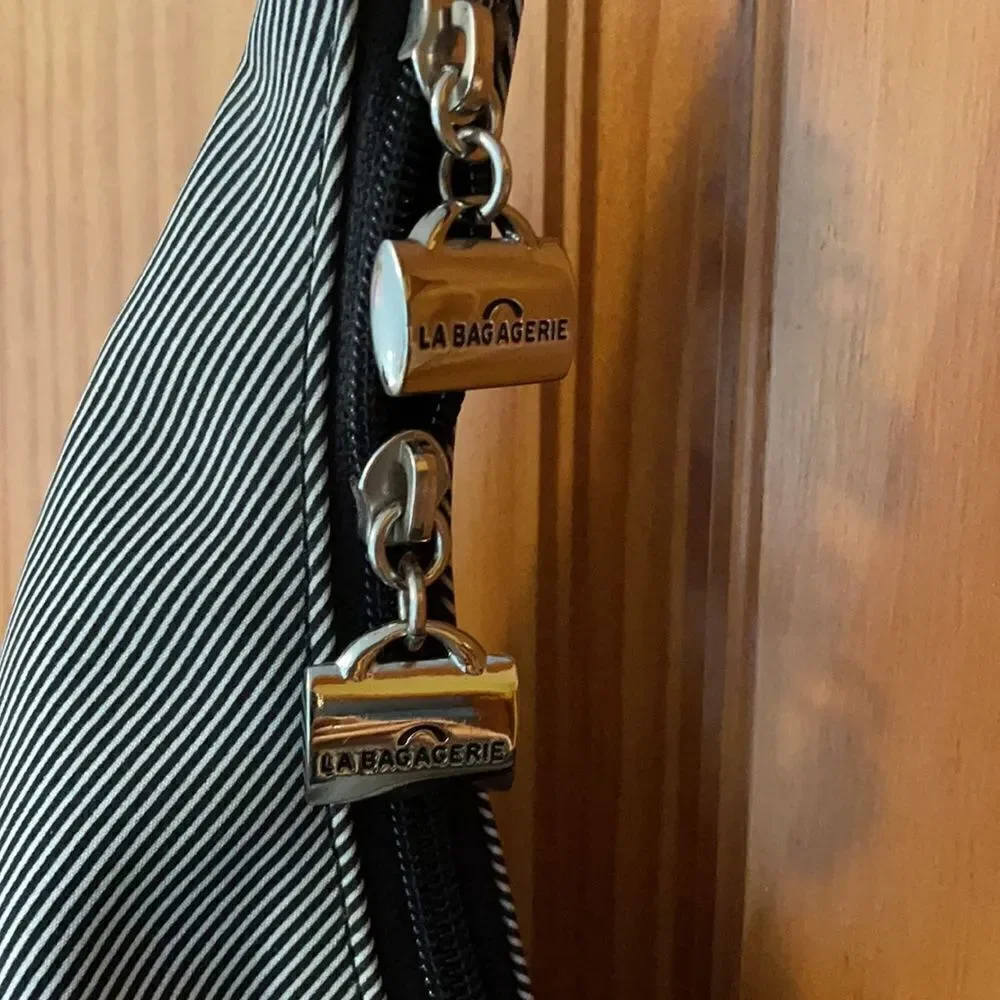 La Bagagerie Zip pinstriped Purse